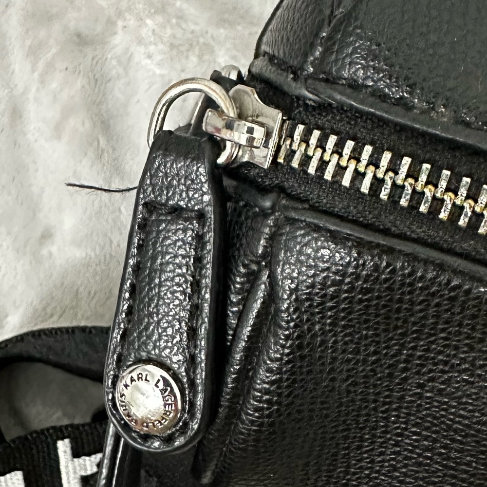 Karl Lagerfeld Paris Black Pebbled Barrel Crossbody Bag with Logo Guitar Strap - Picture 6 of 13